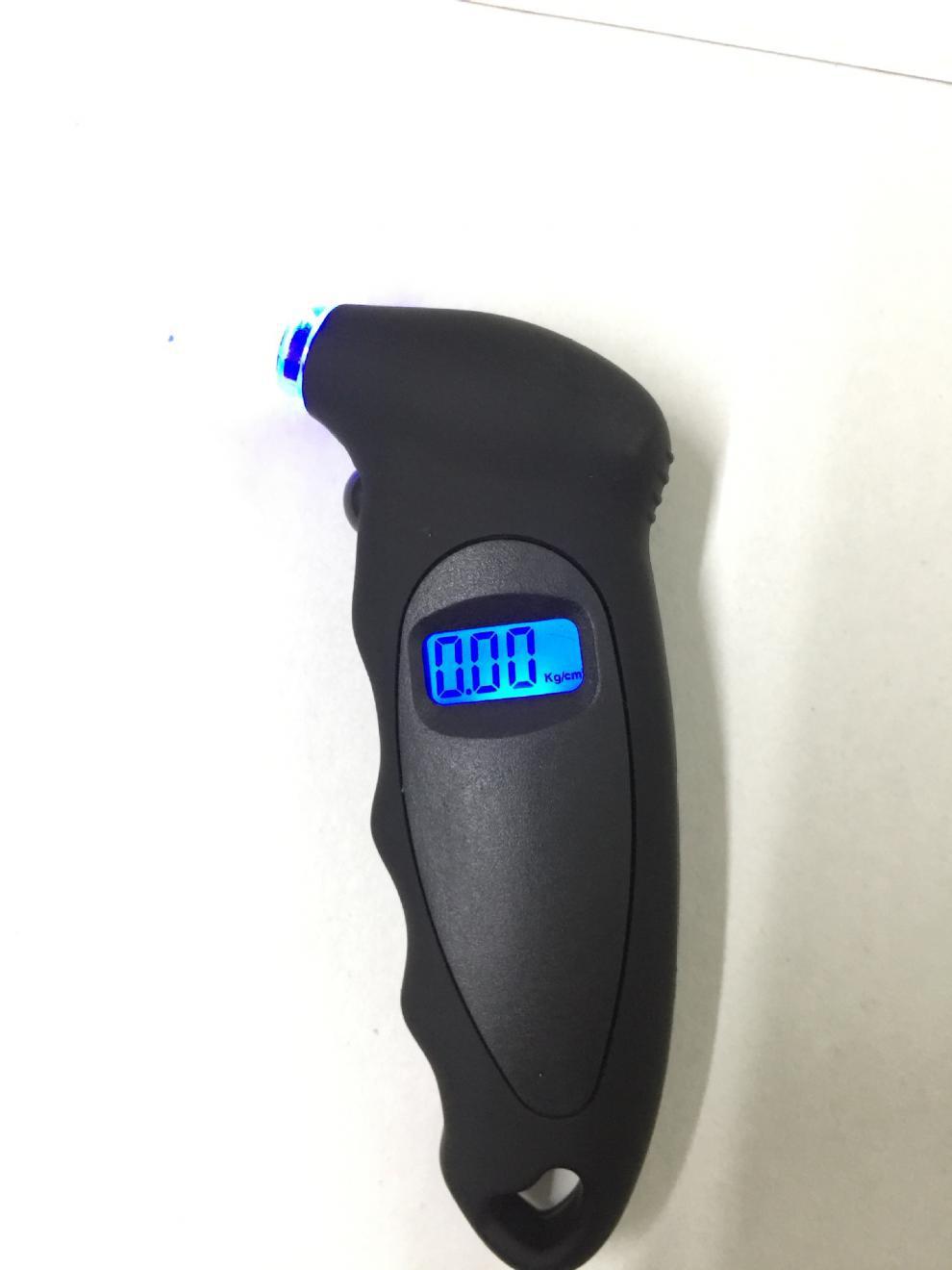 Tire pressure gauge with illuminated display